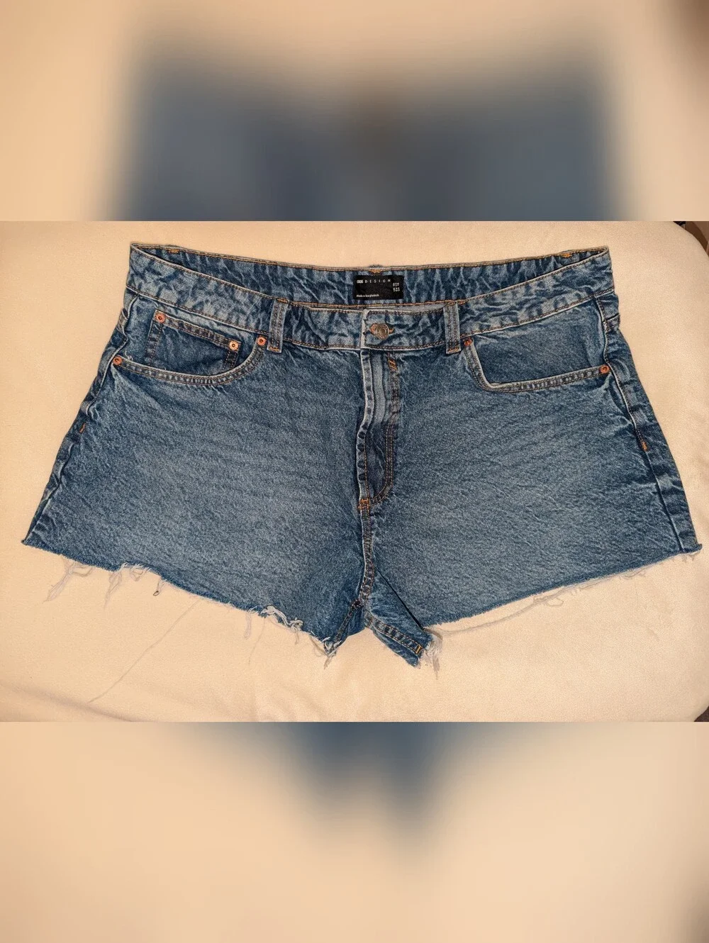 ASOS DESIGN denim relaxed shorts in midwash blue